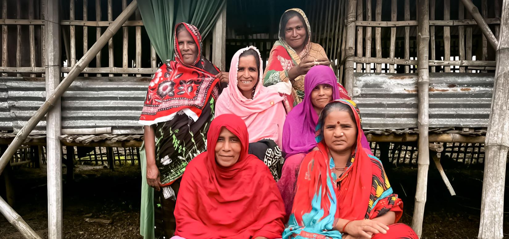 Goat farmers who benefit from Empower, a disaster risk reduction project jointly run by UN Women-United Nations Environment Programme, pose on 18 May 2023 in Kulpala Math, Chuadanga District, Khulna Division of Bangladesh.