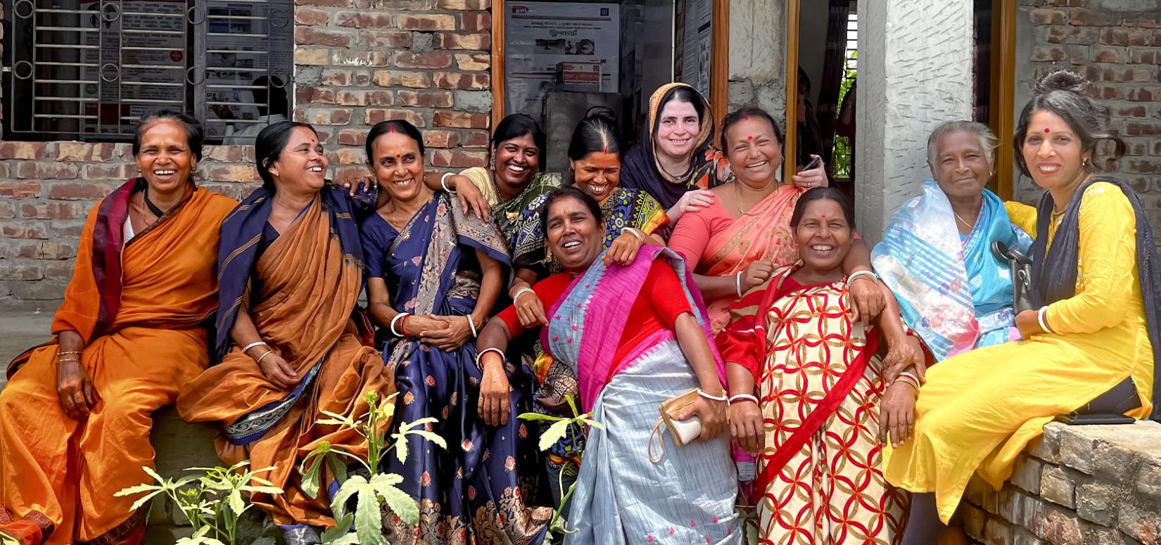 Women leading civil society organizations supported by UN Women under the EmPower disaster risk reduction programme pose in Dacope, Khulna Division of Bangladesh, on 19 May 2023.