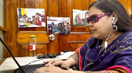 Nazma Ara Begum Poppy works at her desk at the UN Women Bangladesh office in Dhaka on 20 June 2023